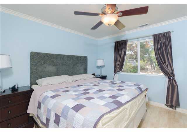 8859 Los Coches Road Lakeside, CA 92040 - Photo 22 of 25 Both bedrooms in this smaller home have walk-in closets and beautiful blond laminate flooring.