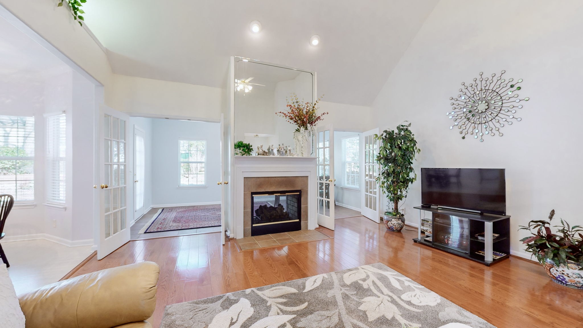 1608 Inverness Drive Spring Hill, TN 37174 - Photo 8 of 44 Two sided gas log fireplace enhances both the living room and the sunroom that you enter into through two sets of french doors