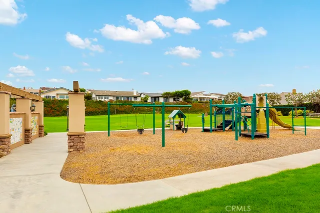 a view of a swimming pool and a lounge chair
