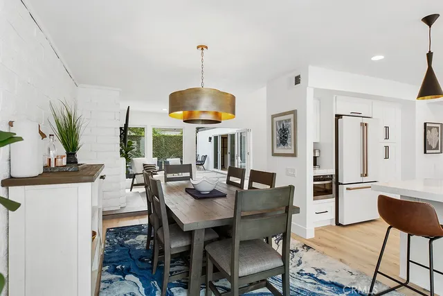 a kitchen with stainless steel appliances granite countertop a stove and white cabinets