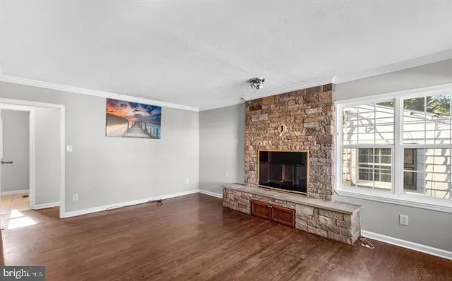 wooden floor fireplace and windows in a room