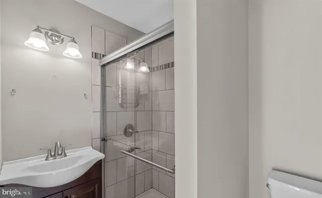 a bathroom with a sink and mirror
