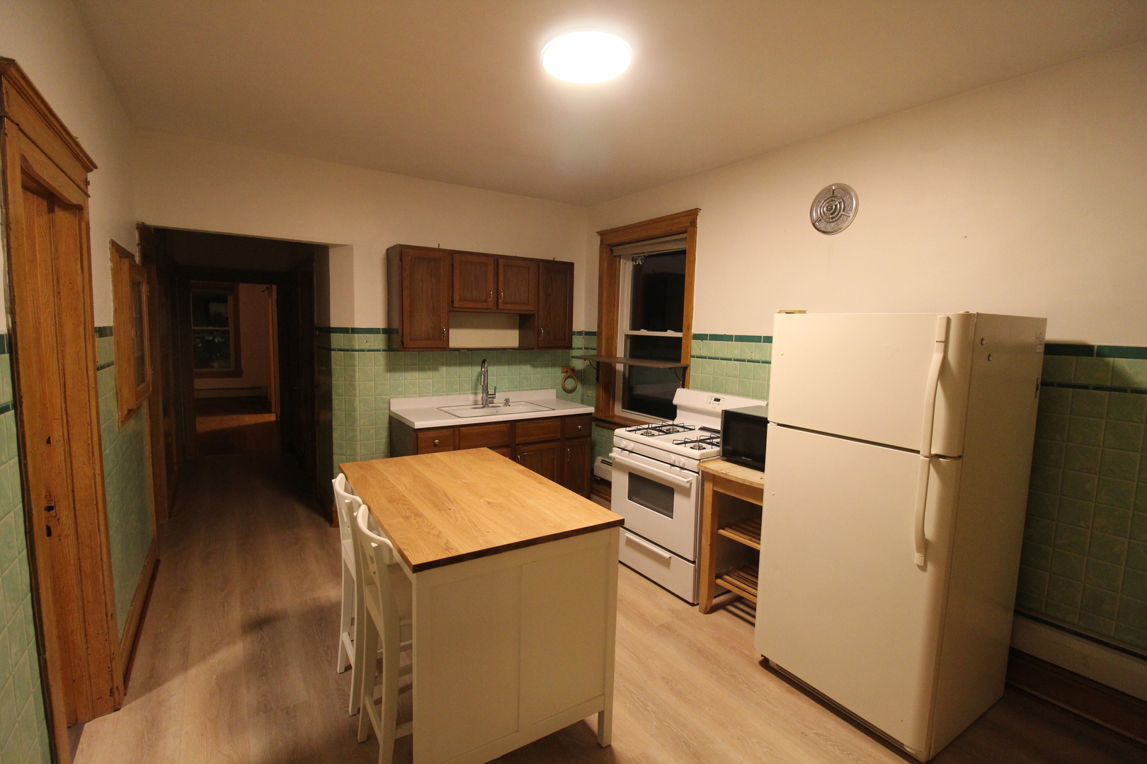 2132 West Walton Street, Unit 2 Chicago, IL 60622 - Photo 3 of 12 a kitchen with a refrigerator sink and microwave