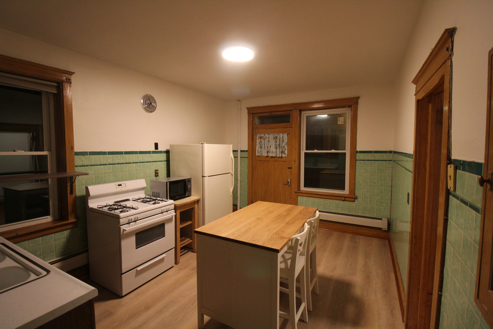 2132 West Walton Street, Unit 2 Chicago, IL 60622 - Photo 4 of 12 a kitchen with a stove and a refrigerator