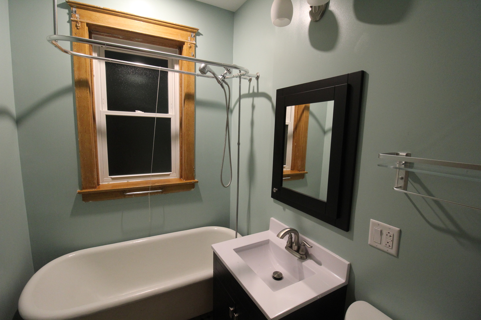 2132 West Walton Street, Unit 2 Chicago, IL 60622 - Photo 9 of 12 a bathroom with a sink and a mirror