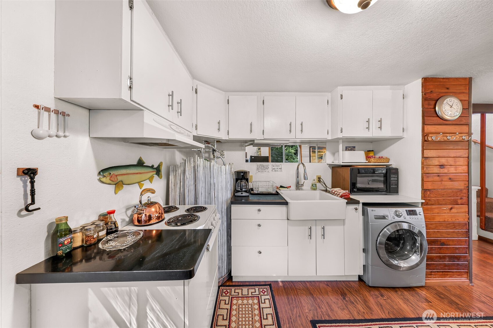 9778 Mt Baker Highway Deming, WA 98244 - Photo 11 of 40 a view of a kitchen with sink appliances and cabinets