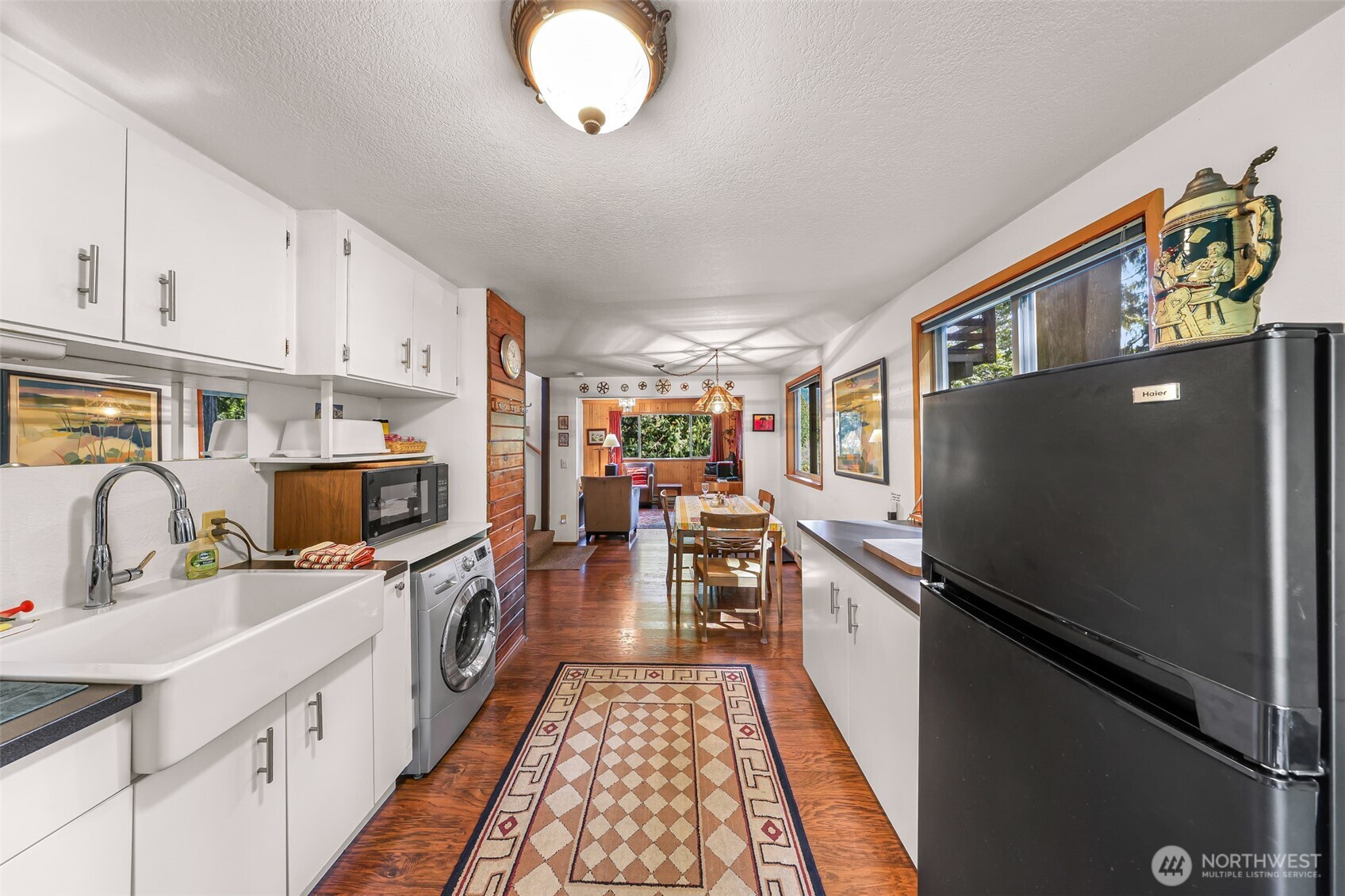 9778 Mt Baker Highway Deming, WA 98244 - Photo 12 of 40 a kitchen with stainless steel appliances a stove refrigerator sink and microwave