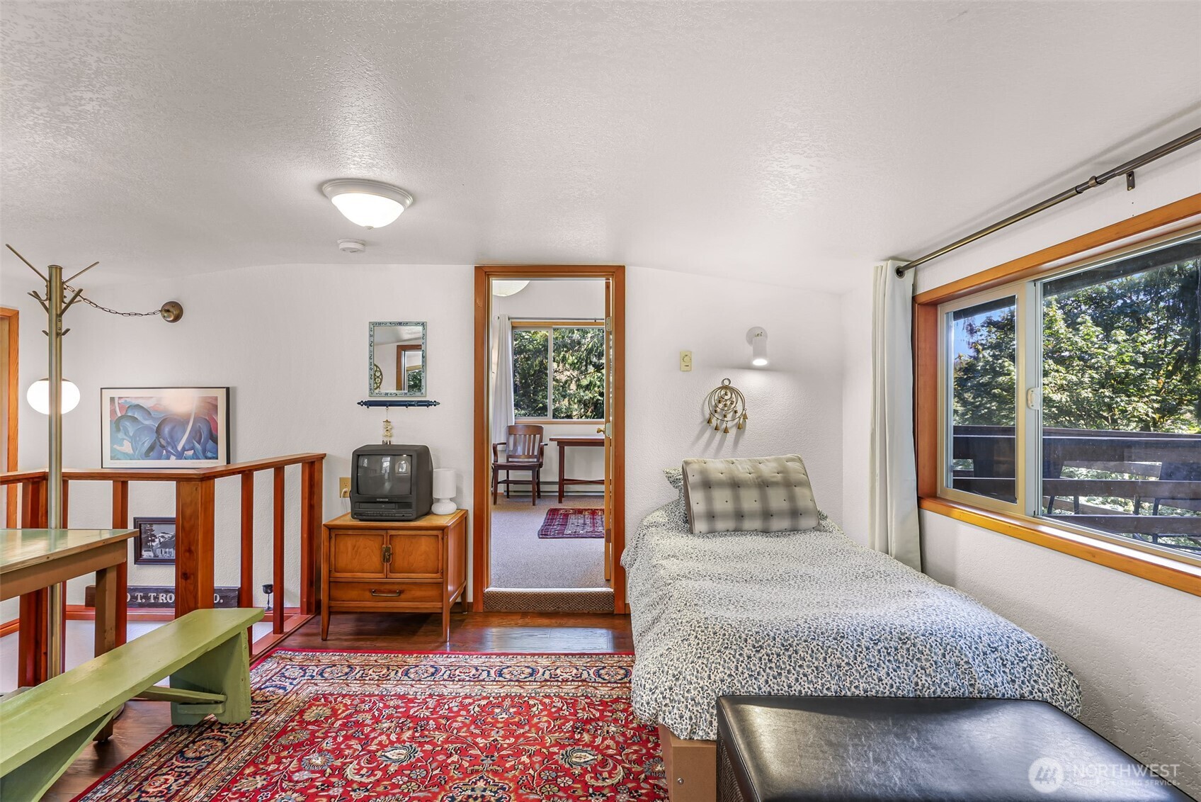 9778 Mt Baker Highway Deming, WA 98244 - Photo 17 of 40 a living room with furniture and a floor to ceiling window