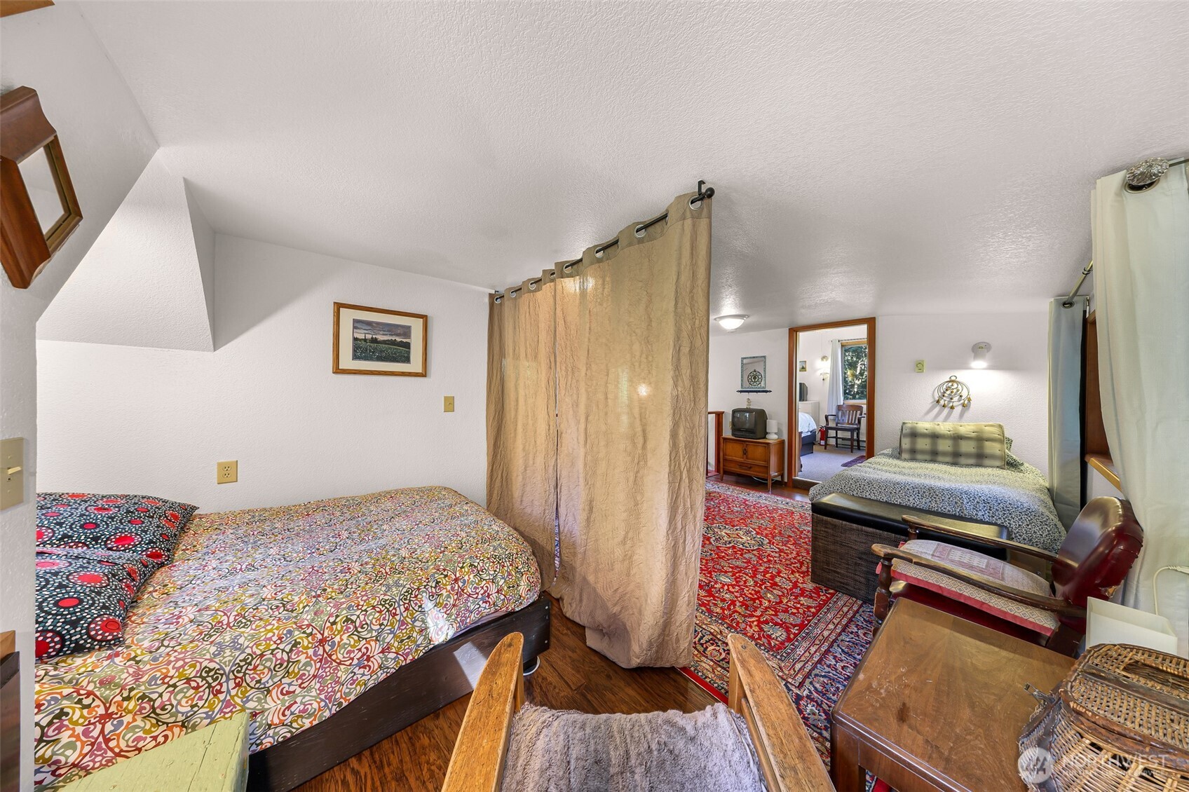 9778 Mt Baker Highway Deming, WA 98244 - Photo 21 of 40 a bedroom with a bed and wooden floor