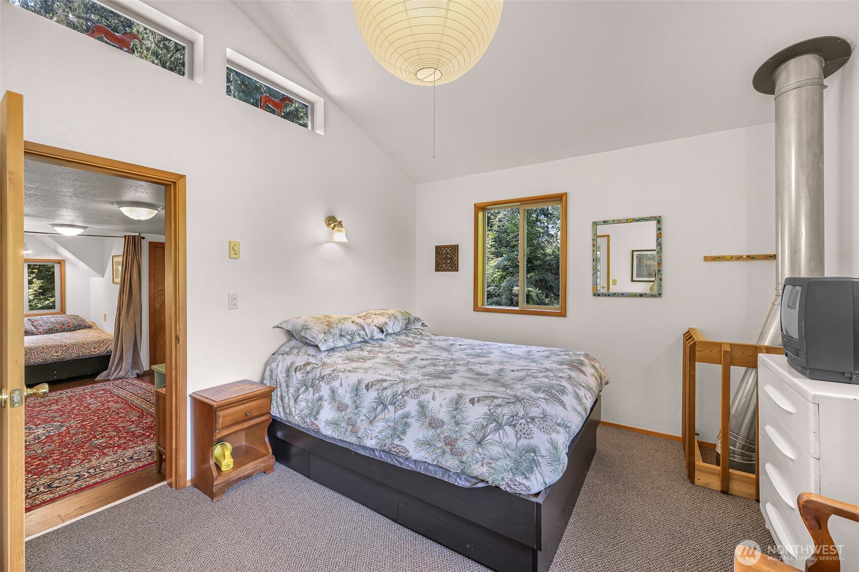 9778 Mt Baker Highway Deming, WA 98244 - Photo 22 of 40 a bedroom with a bed and a table in it