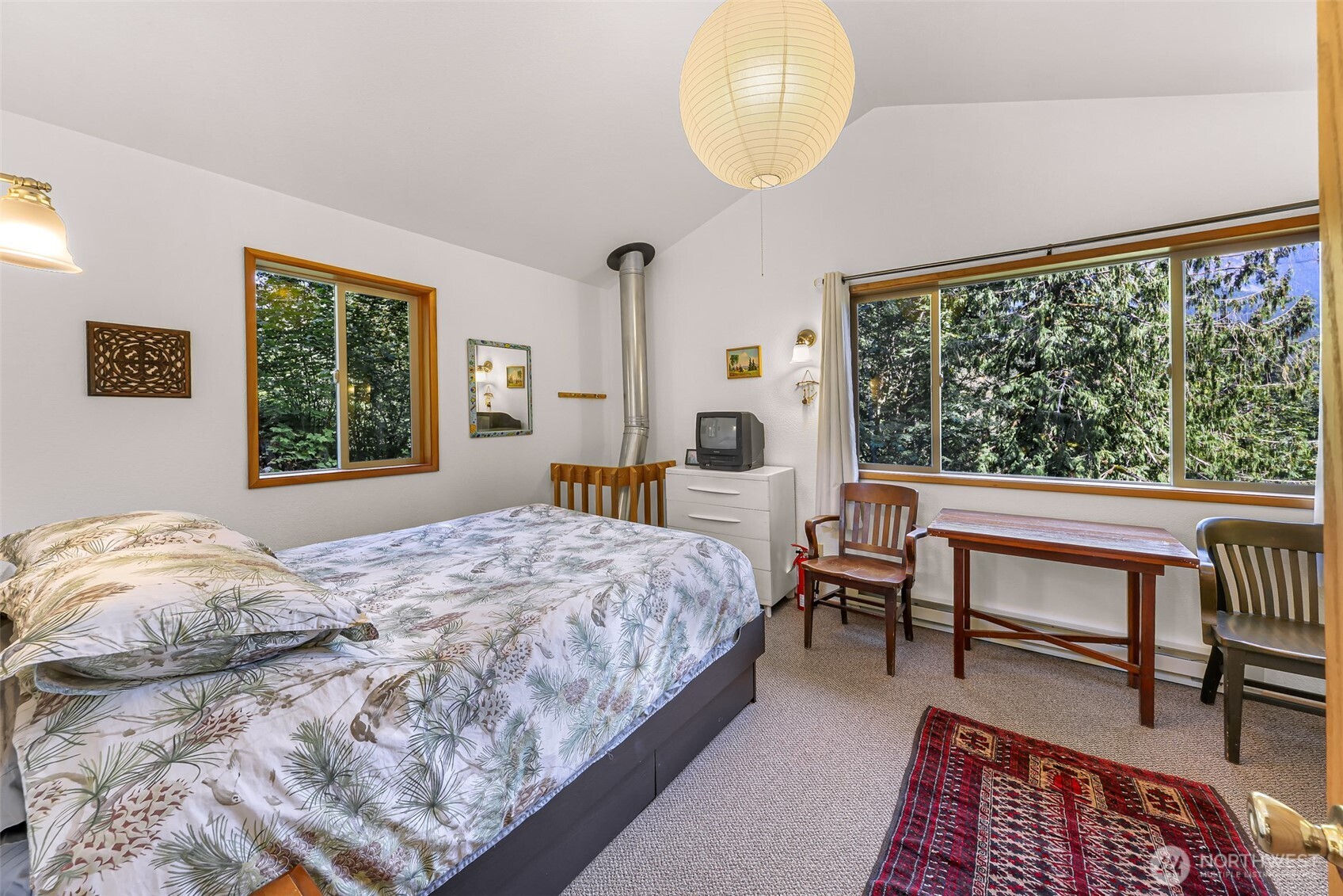 9778 Mt Baker Highway Deming, WA 98244 - Photo 23 of 40 a bedroom with a bed and a large window