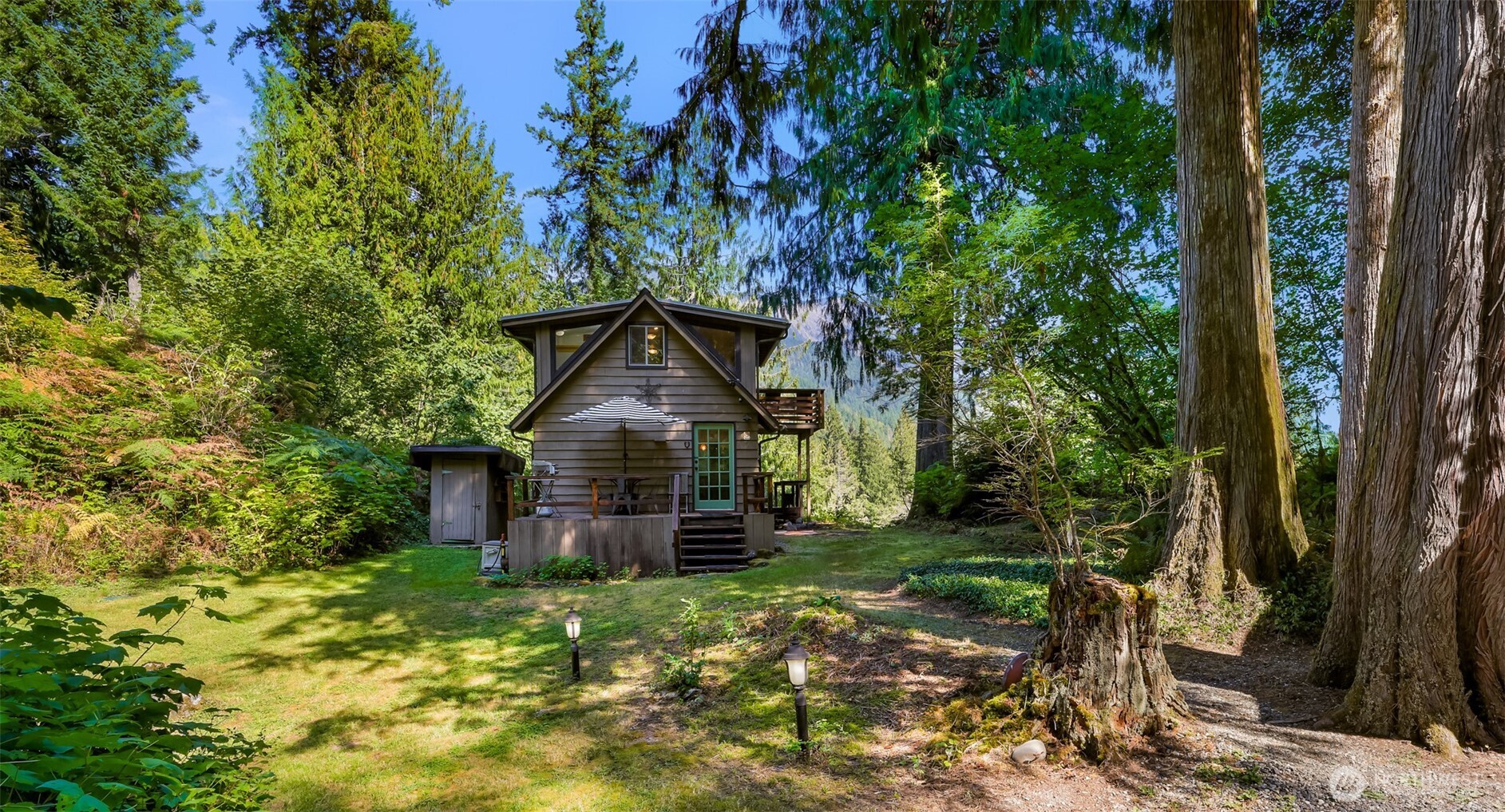 9778 Mt Baker Highway Deming, WA 98244 - Photo 29 of 40 a view of a house with a tree in the background