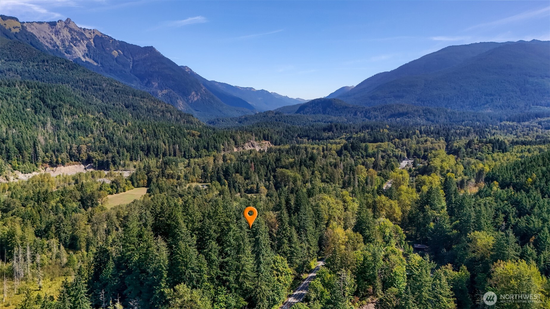 9778 Mt Baker Highway Deming, WA 98244 - Photo 34 of 40 a view of a lush green hillside and a building