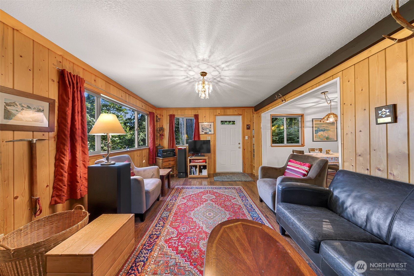 9778 Mt Baker Highway Deming, WA 98244 - Photo 4 of 40 a living room with furniture a fireplace and large windows