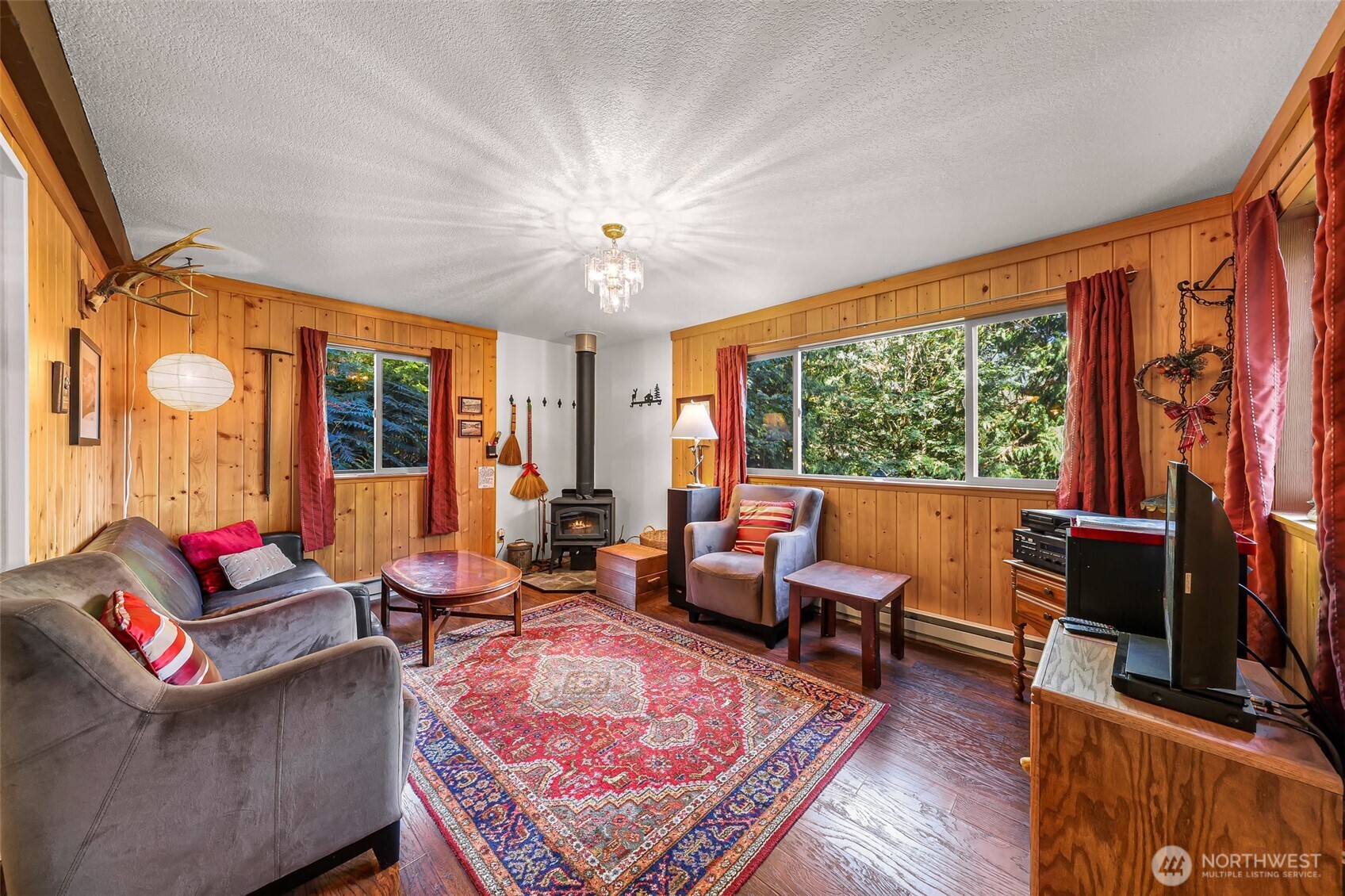 9778 Mt Baker Highway Deming, WA 98244 - Photo 5 of 40 a living room with furniture a rug and a large window