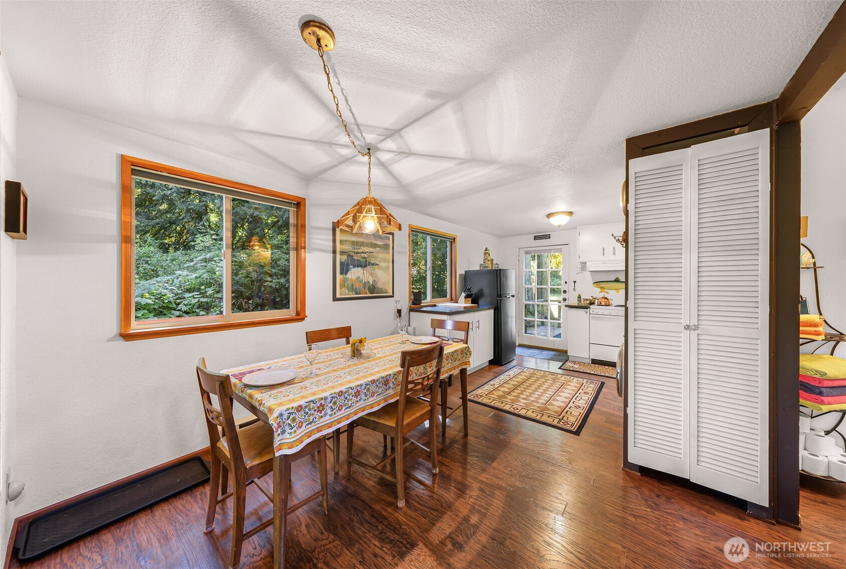 9778 Mt Baker Highway Deming, WA 98244 - Photo 7 of 40 a view of a dining room with furniture window and wooden floor