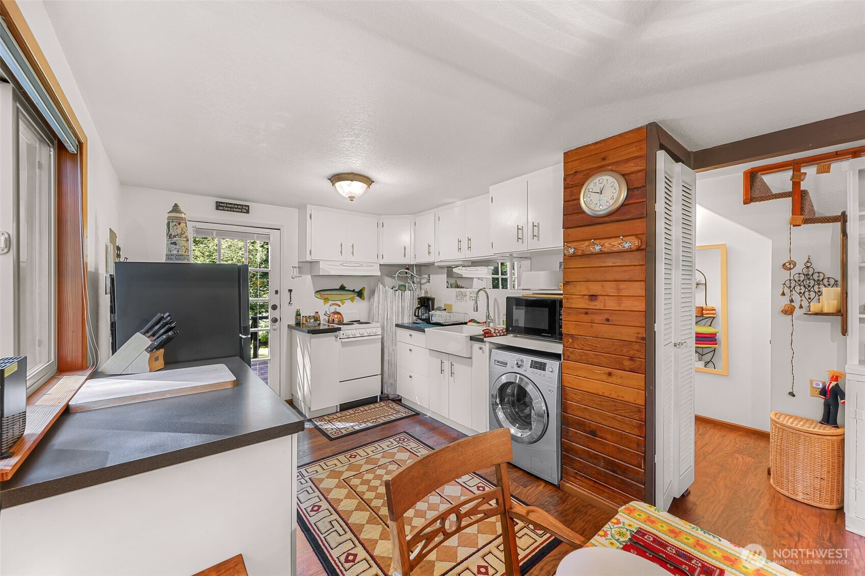 9778 Mt Baker Highway Deming, WA 98244 - Photo 9 of 40 a kitchen with a refrigerator and a stove top oven