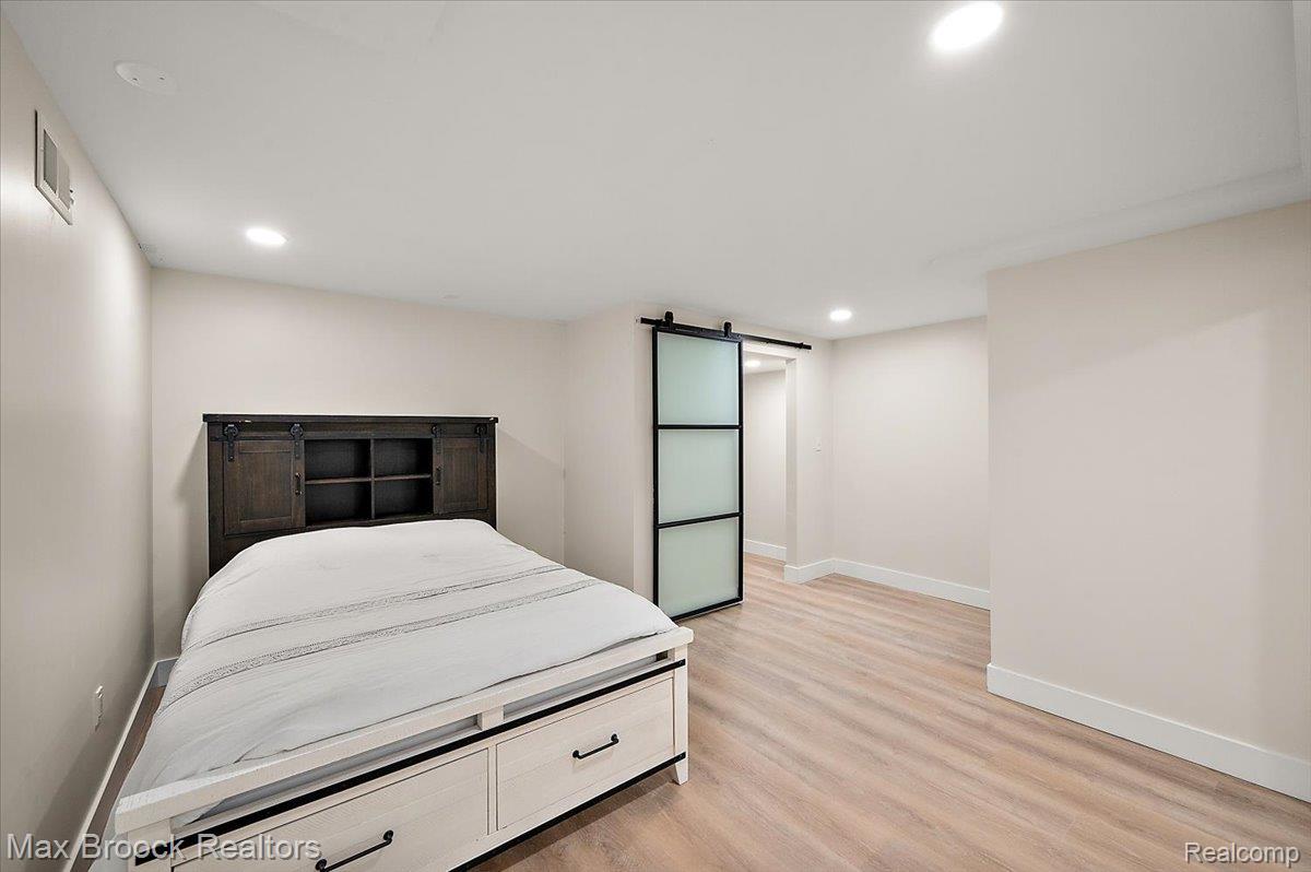 4597 Clarkston Road Clarkston, MI 48348 - Photo 45 of 74 Recessed lighting illuminates wood-finish flooring
