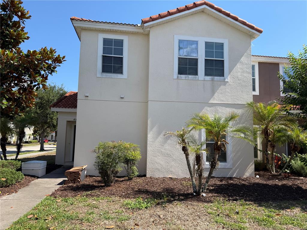 4573 Ada Lane Kissimmee, FL 34746 - Photo 1 of 37 a front view of a house with garden