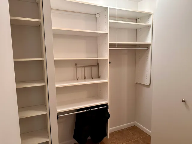 a view of an empty walk in closet
