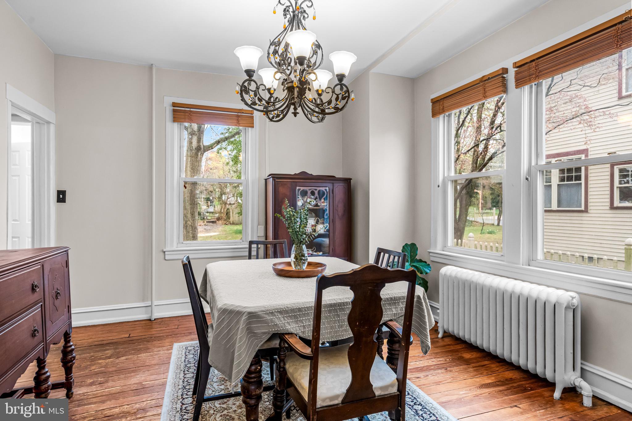 403 Midway Riverton, NJ 08077 - Photo 19 of 53 a dining room with furniture a livingroom and chandelier