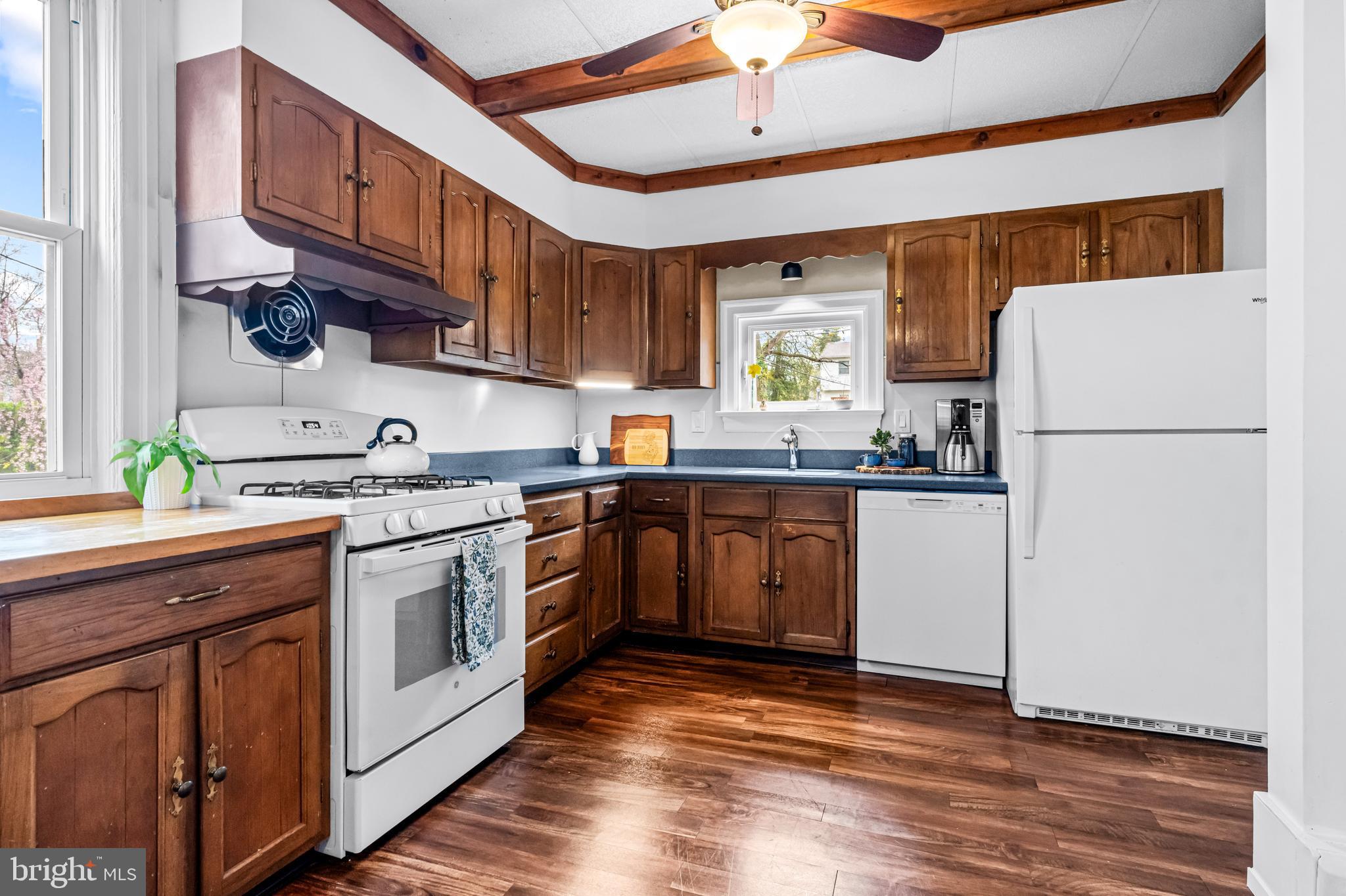 403 Midway Riverton, NJ 08077 - Photo 26 of 53 a kitchen with a sink a refrigerator and window