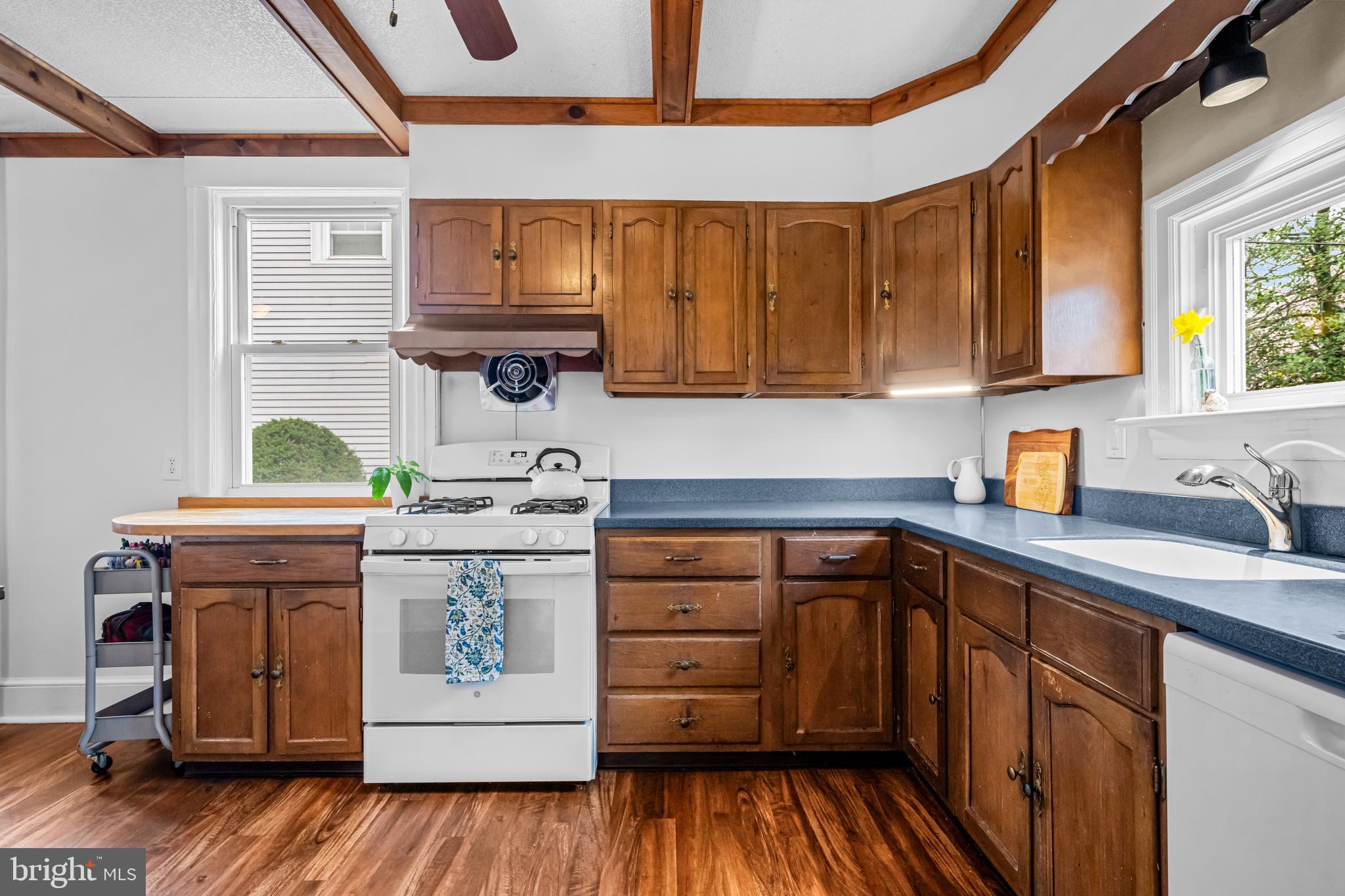 403 Midway Riverton, NJ 08077 - Photo 27 of 53 a kitchen with stainless steel appliances granite countertop a stove and a sink