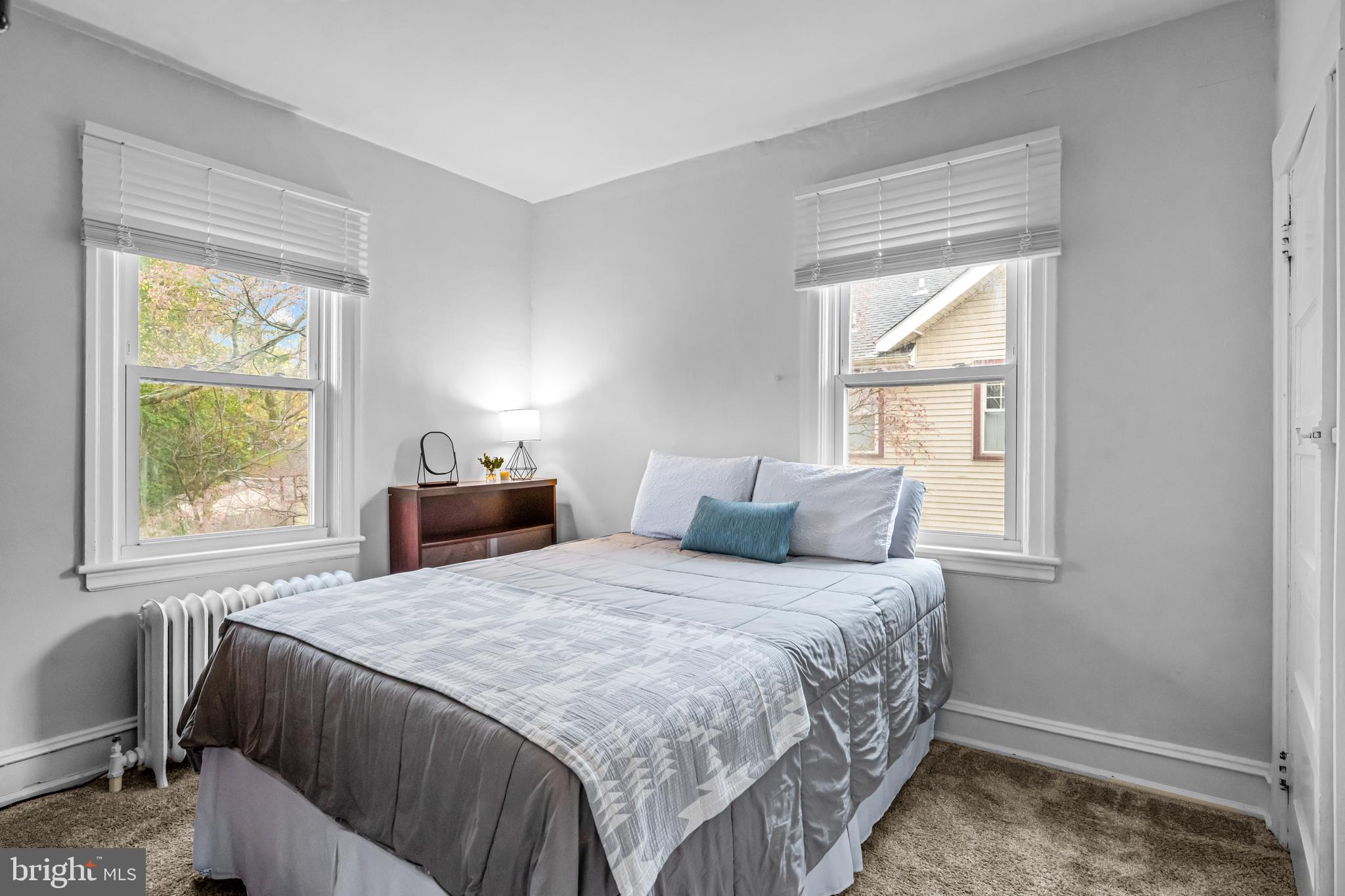 403 Midway Riverton, NJ 08077 - Photo 34 of 53 a bedroom with a bed and a window