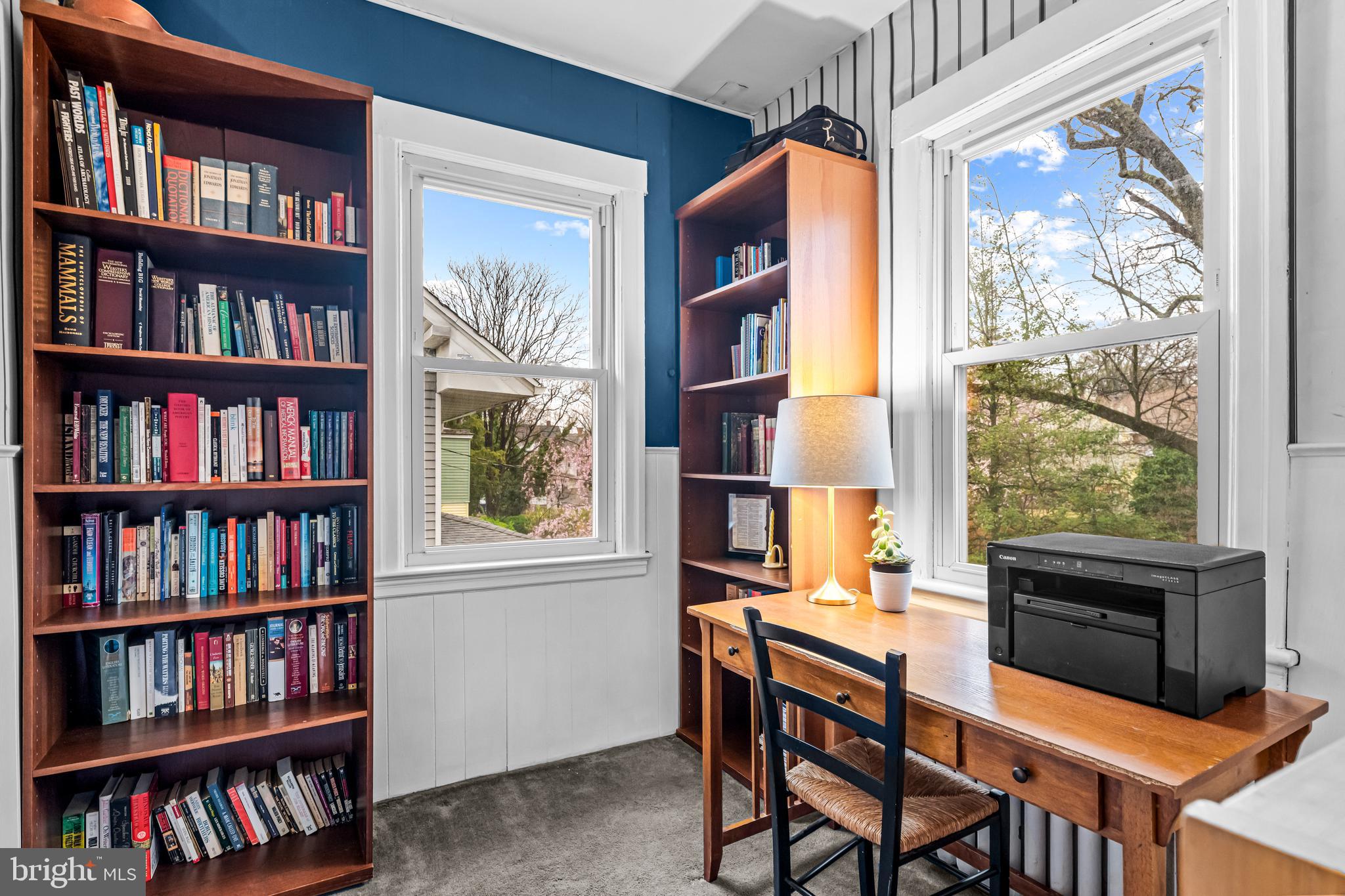 403 Midway Riverton, NJ 08077 - Photo 35 of 53 a view of a workspace with furniture and a bookshelf