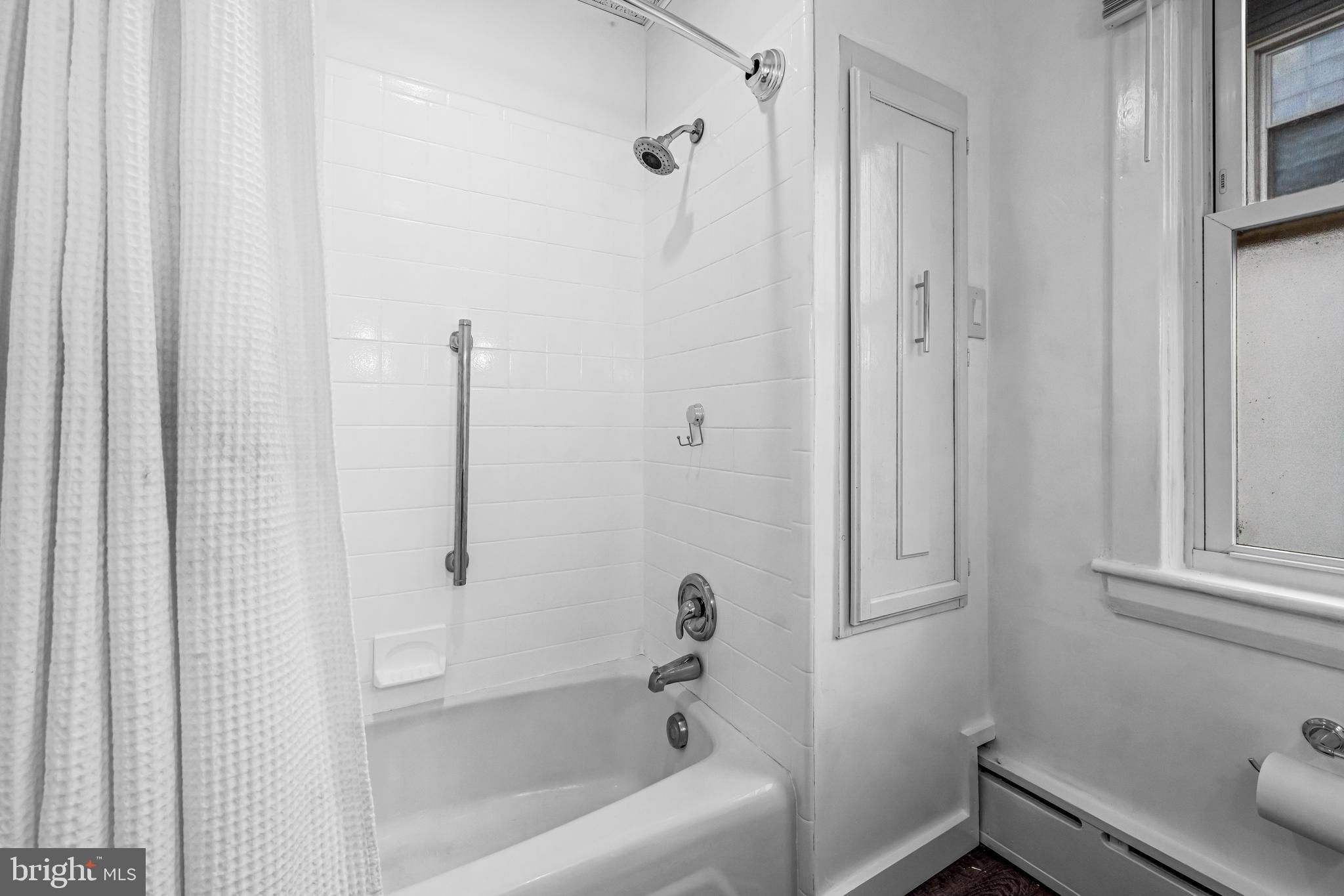 403 Midway Riverton, NJ 08077 - Photo 39 of 53 a bathroom with a bathtub and a shower