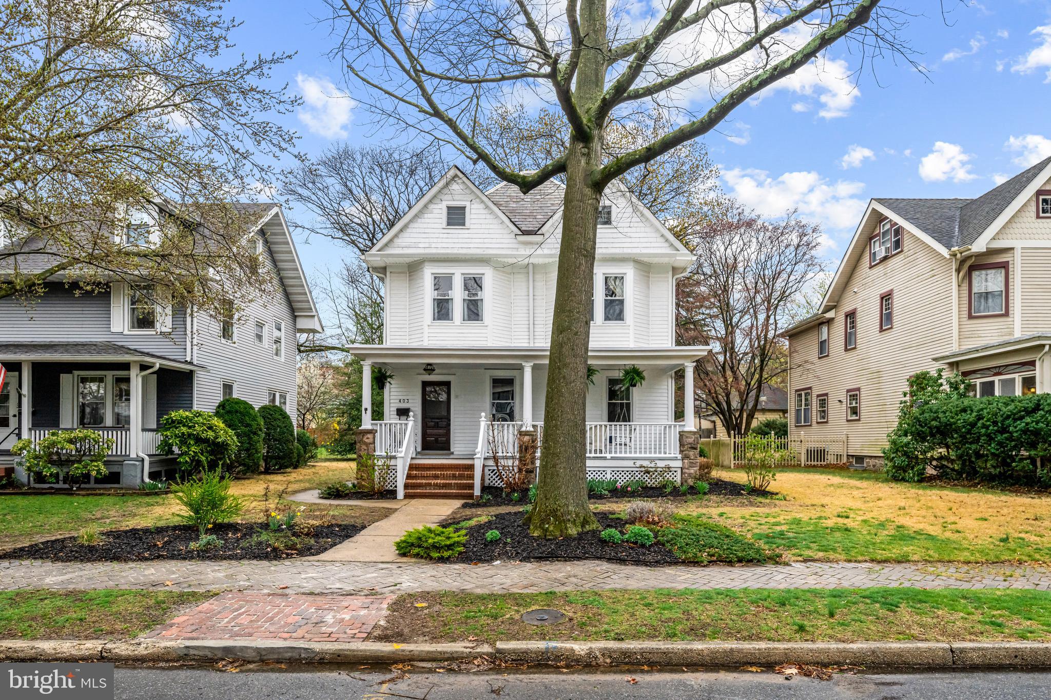 403 Midway Riverton, NJ 08077 - Photo 5 of 53 a front view of a house with garden