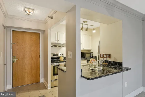 a kitchen with a sink and refrigerator
