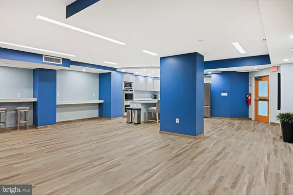 a view of a kitchen with a refrigerator and a cabinets