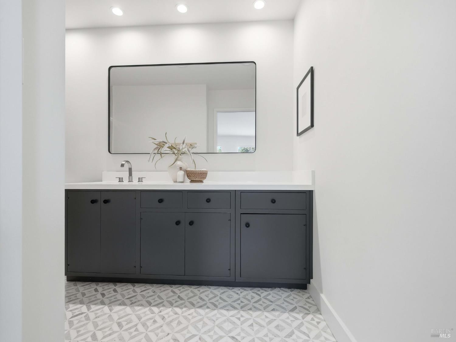 148 Dominican Drive San Rafael, CA 94901 - Photo 28 of 60 a bathroom with a sink and a mirror