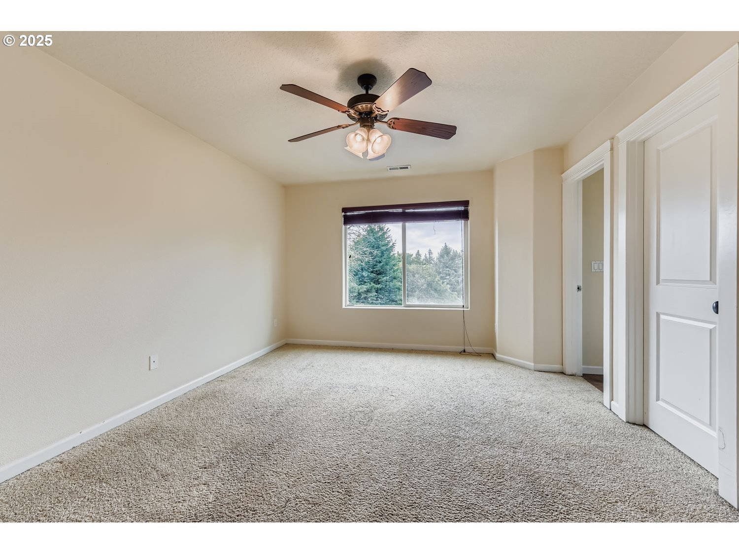 7912 Northeast Klickitat Street Portland, OR 97213 - Photo 14 of 29 a view of a livingroom with a ceiling fan and window