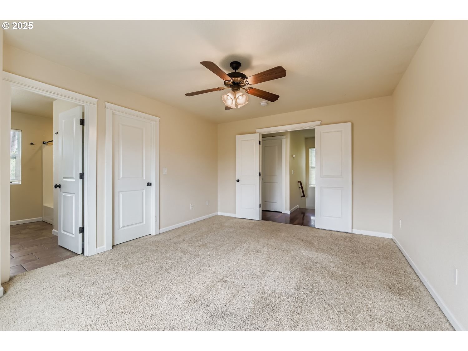 7912 Northeast Klickitat Street Portland, OR 97213 - Photo 15 of 29 a view of a livingroom with a ceiling fan and a chandelier fan