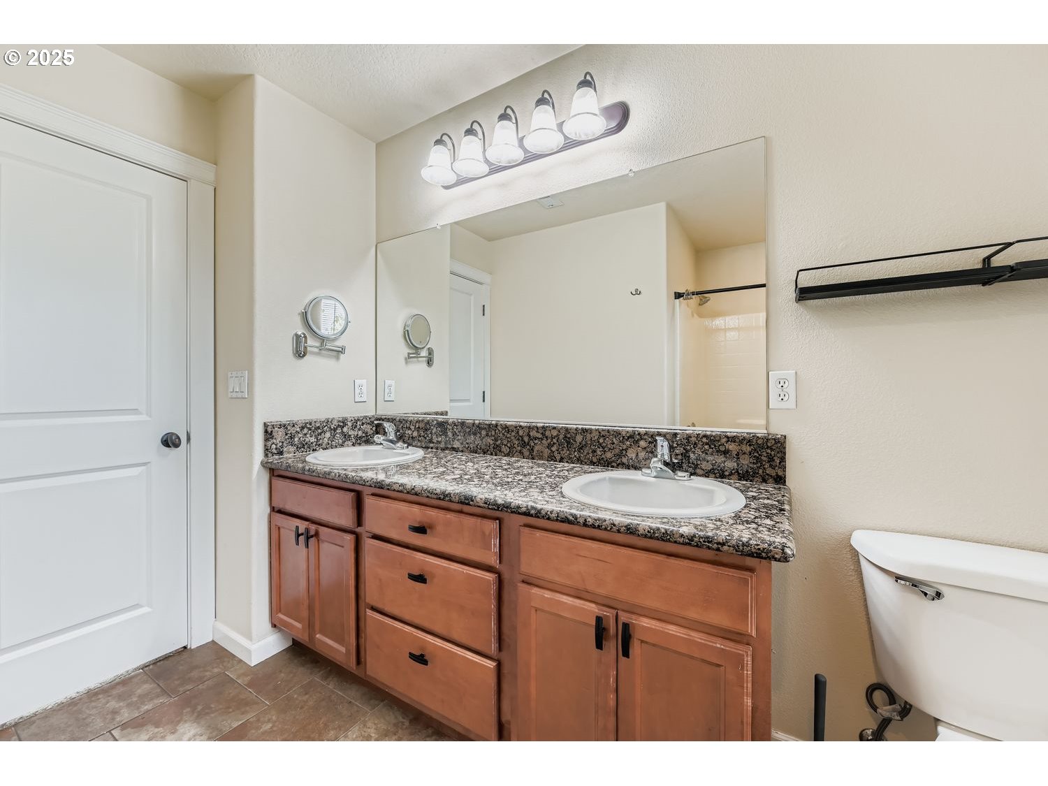 7912 Northeast Klickitat Street Portland, OR 97213 - Photo 17 of 29 a bathroom with a granite countertop sink a toilet and a shower