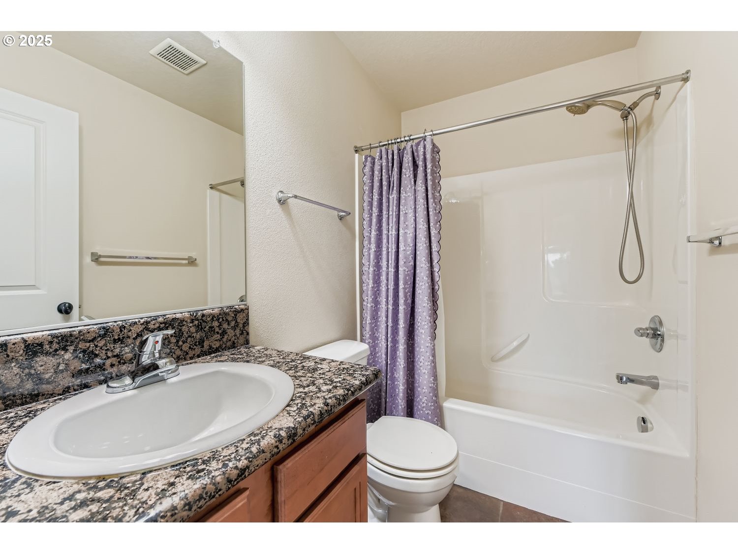 7912 Northeast Klickitat Street Portland, OR 97213 - Photo 19 of 29 a bathroom with a granite countertop sink toilet a shower and a mirror