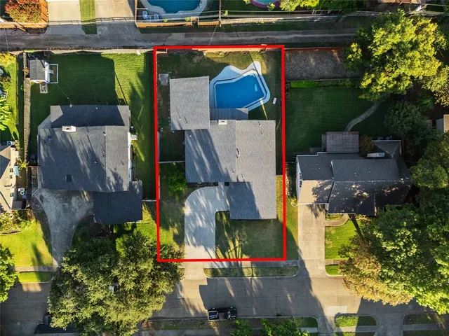 an aerial view of houses and roads
