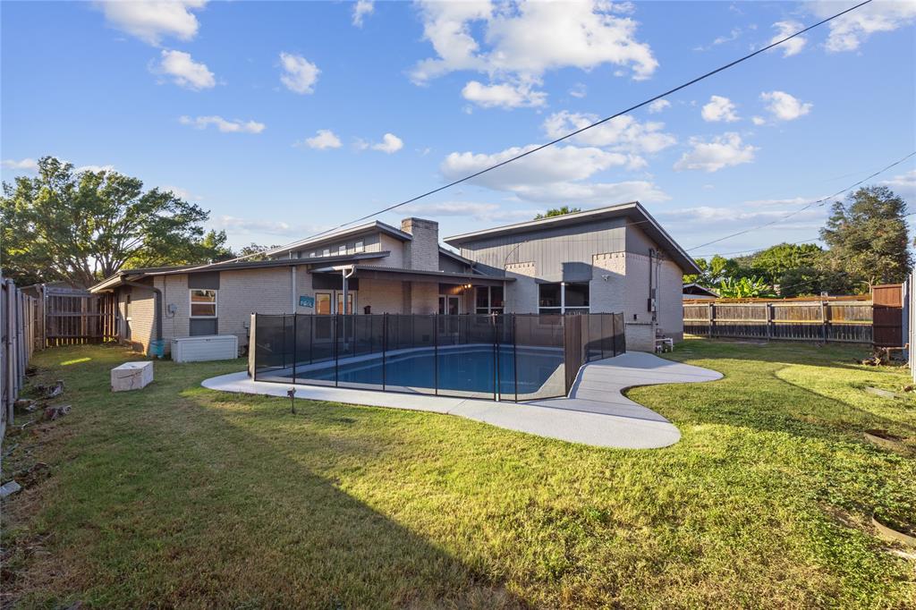 12218 Treeview Lane Farmers Branch, TX 75234 - Photo 5 of 17 a swimming pool with outdoor seating and yard