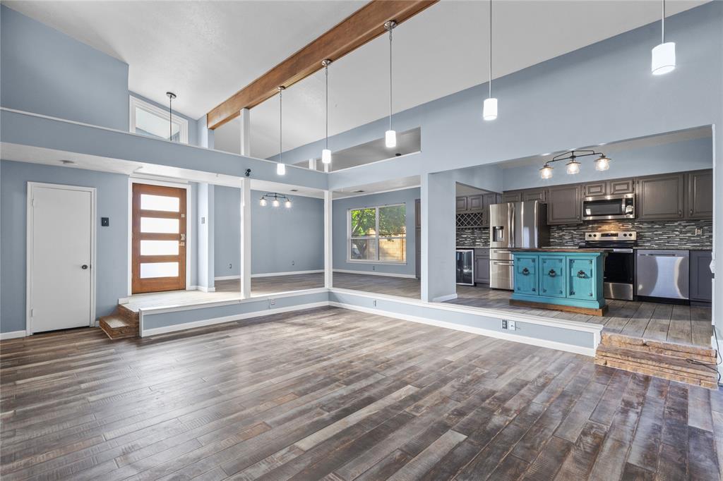 12218 Treeview Lane Farmers Branch, TX 75234 - Photo 7 of 17 a big room with wooden floor and windows