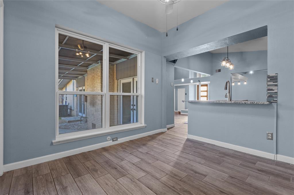 12218 Treeview Lane Farmers Branch, TX 75234 - Photo 9 of 17 wooden floor in an empty room with a window