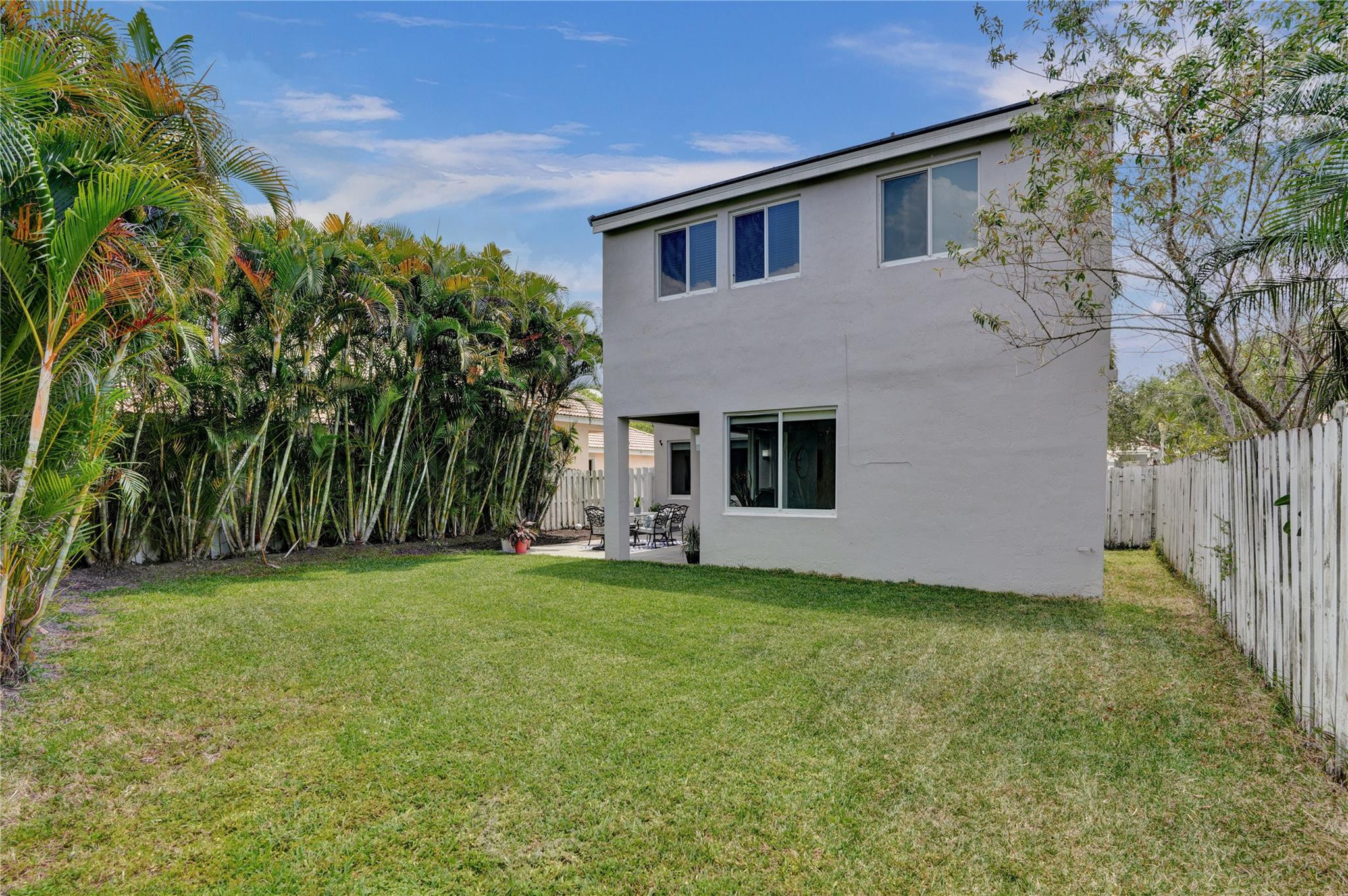 881 Briar Ridge Road Weston, FL 33327 - Photo 54 of 59 a front view of a house with a yard and garage
