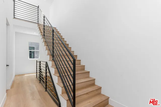 a view of entryway with wooden floor