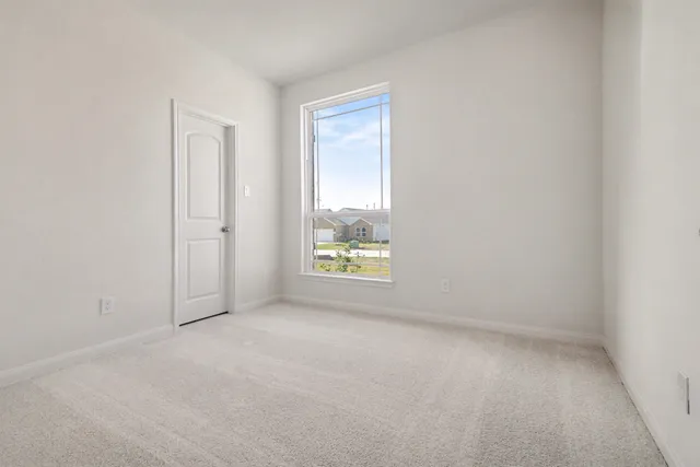 an empty room with closet area