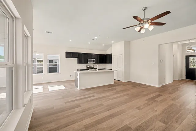 a view of kitchen with cabinets and wooden floor