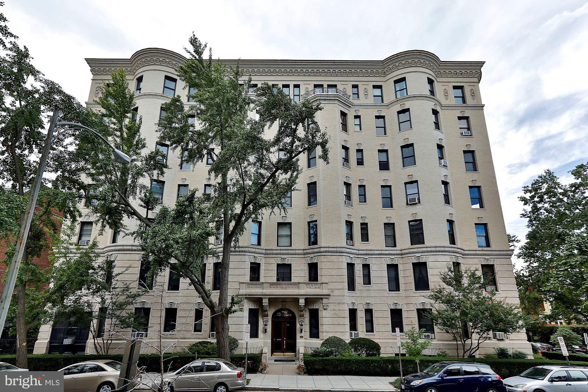 2220 20th Street Northwest, Unit 57 Washington, DC 20009 - Photo 2 of 27 a large building with a clock on the wall