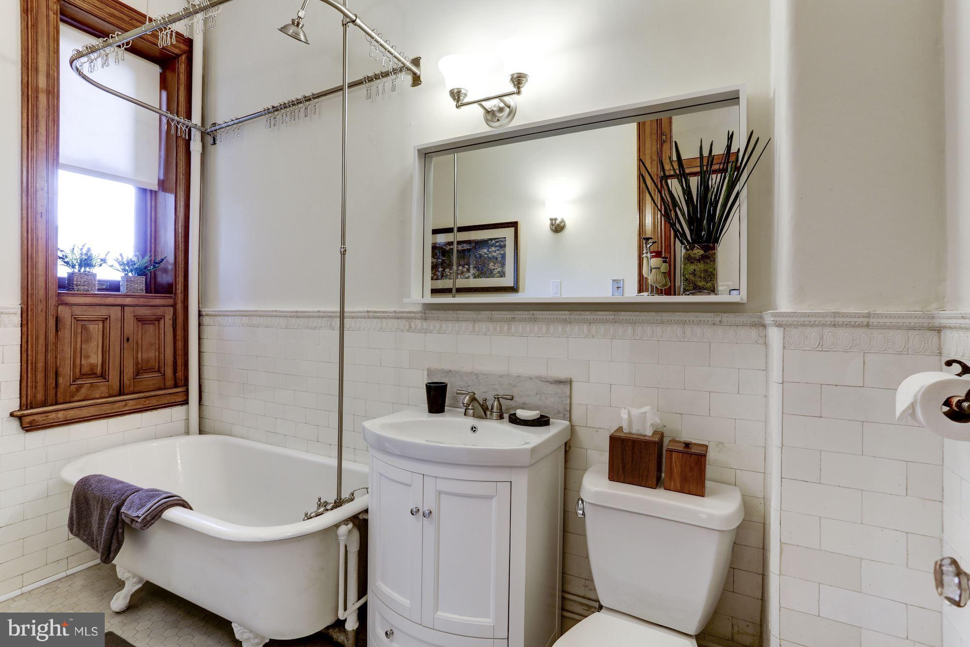 2220 20th Street Northwest, Unit 57 Washington, DC 20009 - Photo 16 of 27 a bathroom with a sink toilet and shower