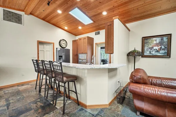 a view of a livingroom with furniture and window