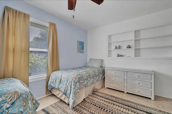 a bedroom with a bed and a cabinets